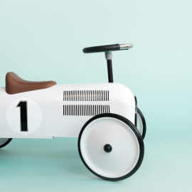 retro-style-beige-toy-car-on-blue-background-styl-2023-11-27-05-13-51-utc-1.jpg