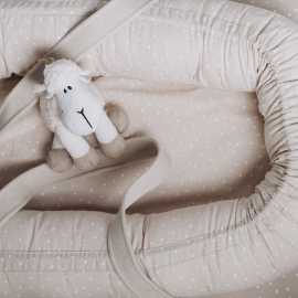 soft-sheep-toy-on-beige-cocoon-baby-nest-for-newb-2023-11-27-04-51-41-utc-1.jpg